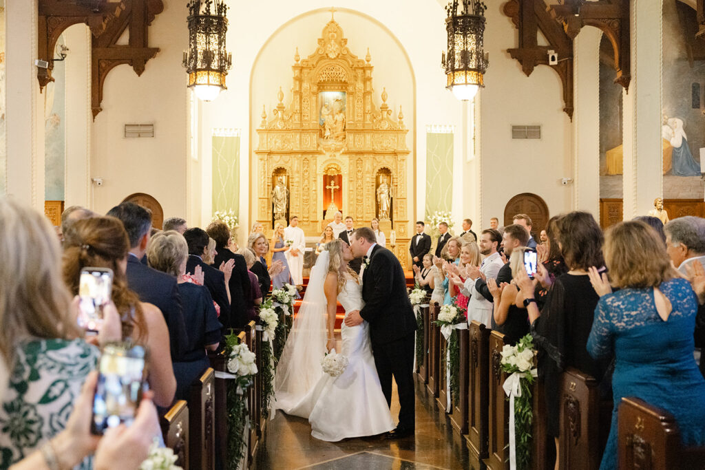Ben and Kelly at the altar during their Holy Family Church wedding ceremony.