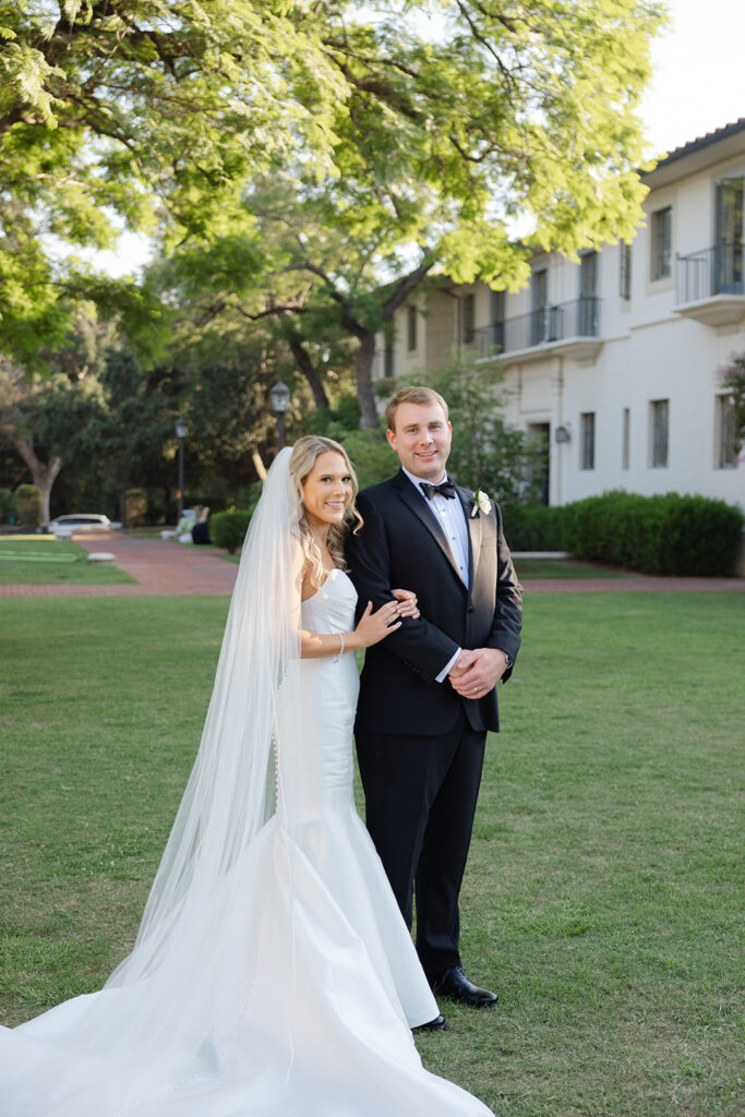 Ben and Kelly walking together across the lawn at the Athenaeum.