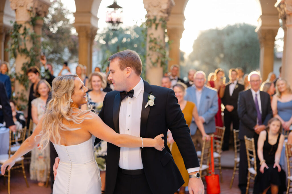 Ben and Kelly dancing together during their outdoor reception.