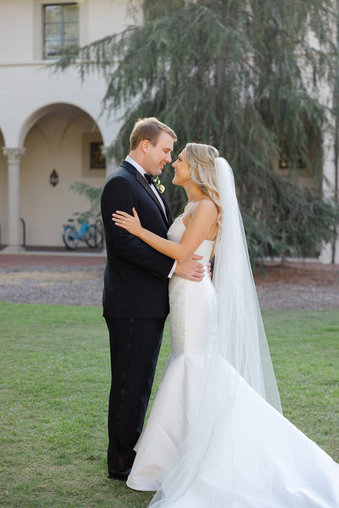 Ben and Kelly kissing in the Athenaeum gardens.