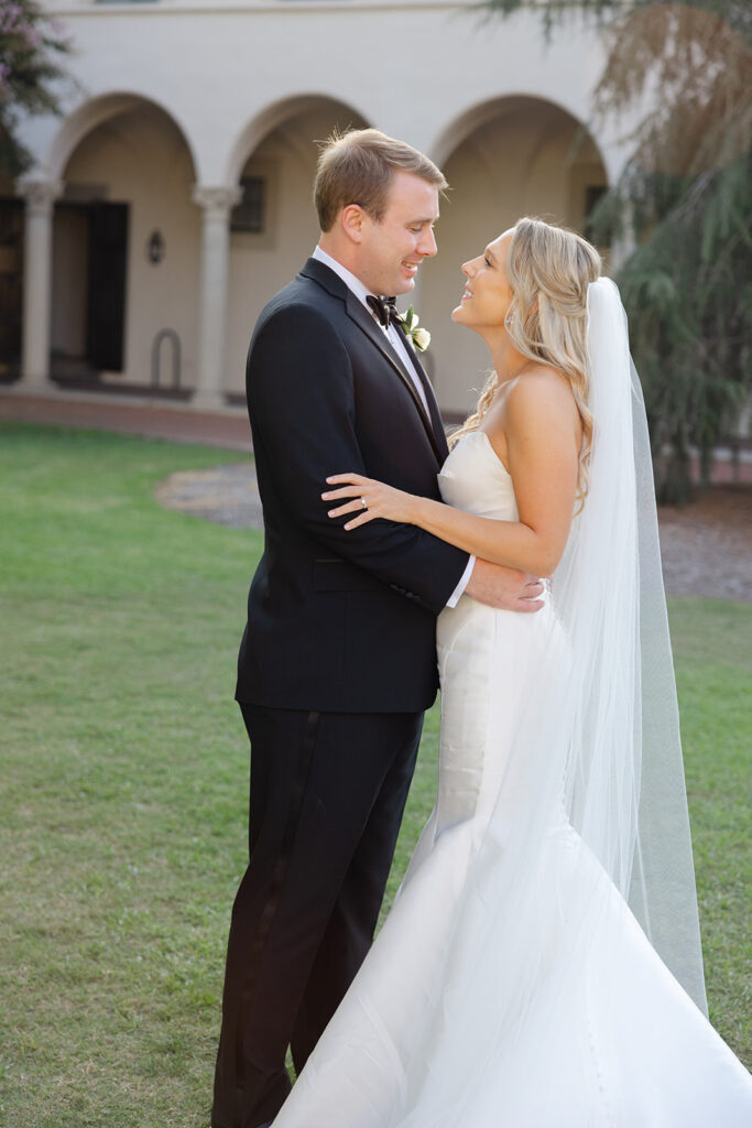 Ben and Kelly facing each other during their wedding portraits.