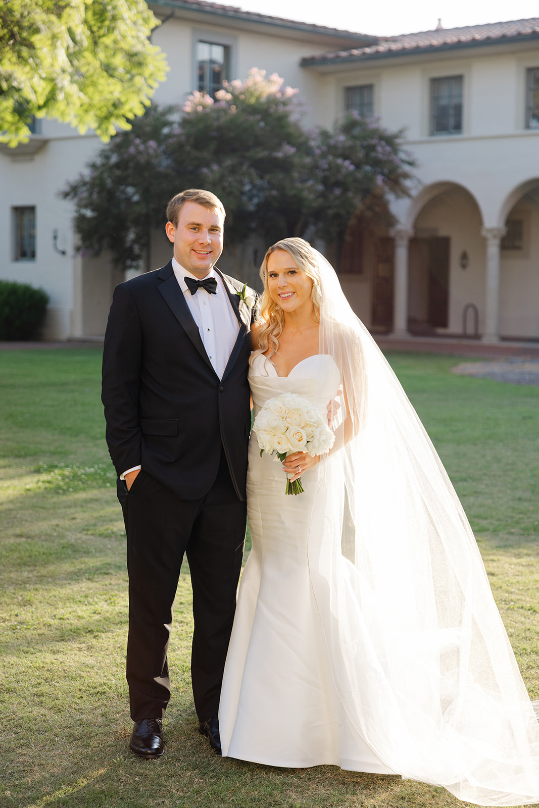 Ben and Kelly standing together on the lawn at the Athenaeum.