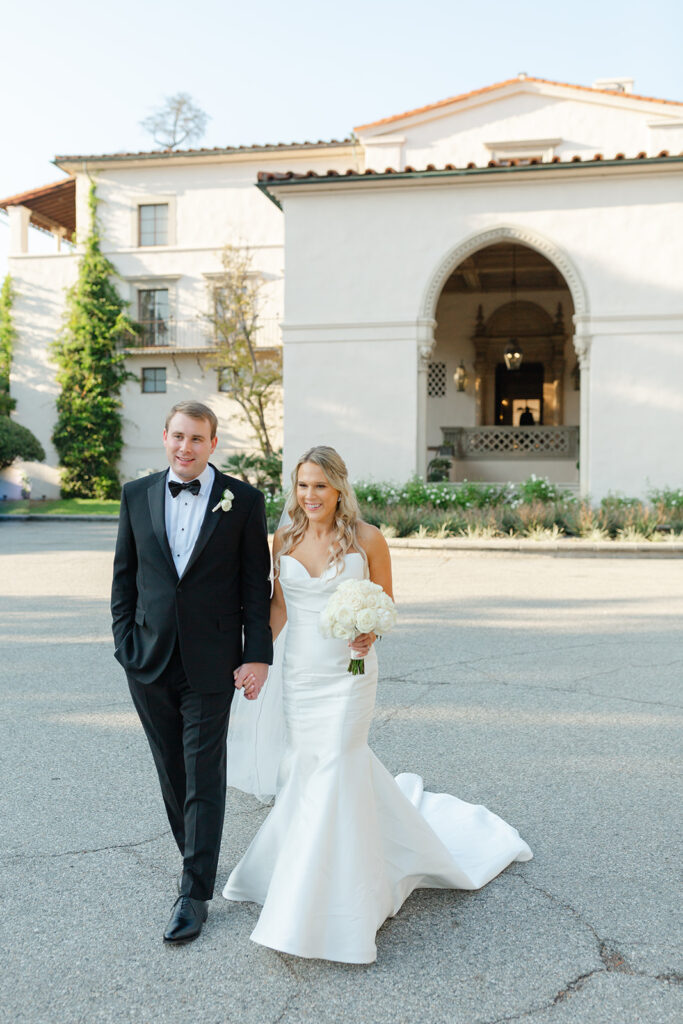 Ben and Kelly walking beside the historic Athenaeum building.