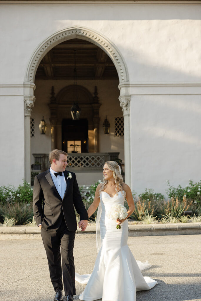Ben and Kelly walking out through the church doorway.