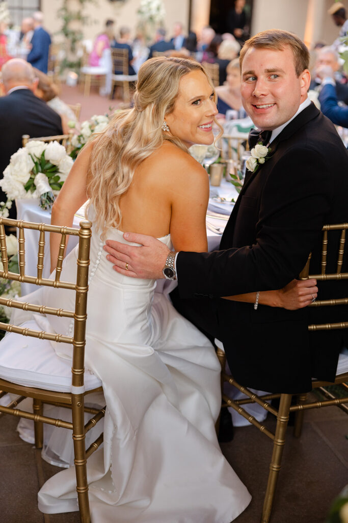 Kelly smiling over her shoulder while dancing with Ben.