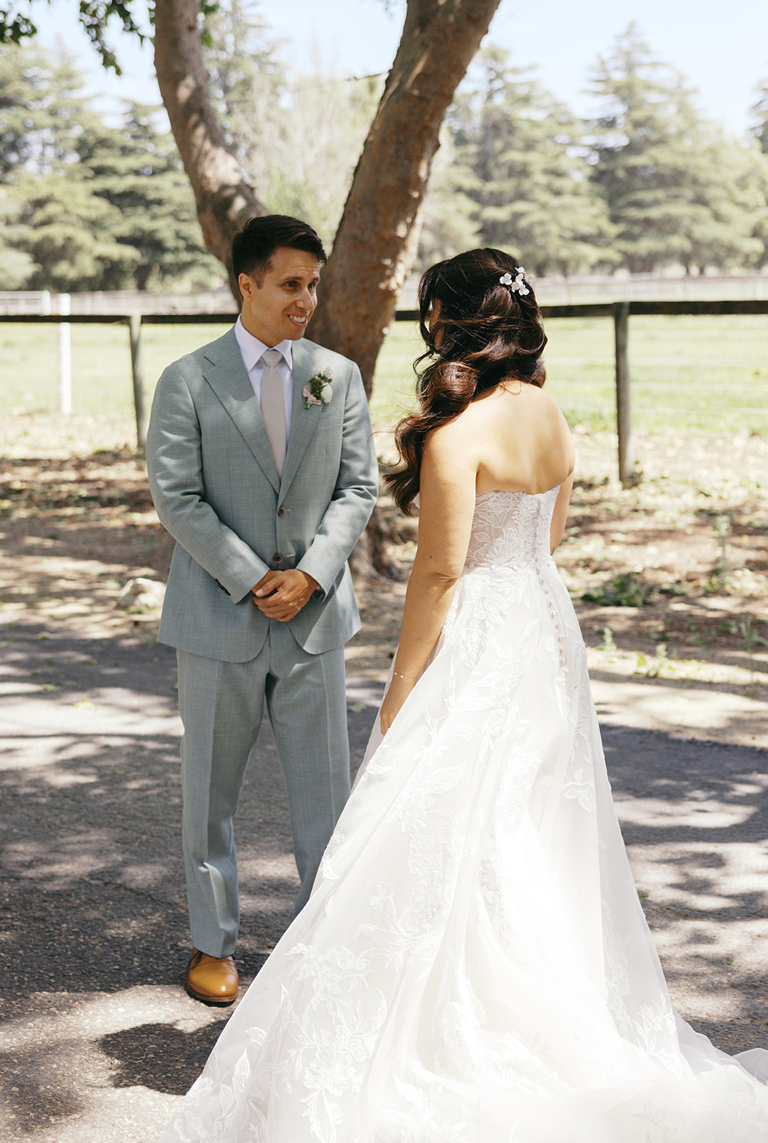 Damien smiling at Rachel during their first look