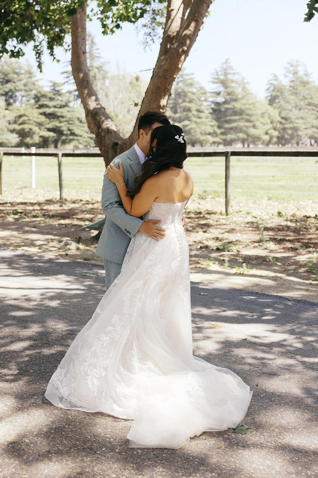 Rachel and Damien embracing during their first look