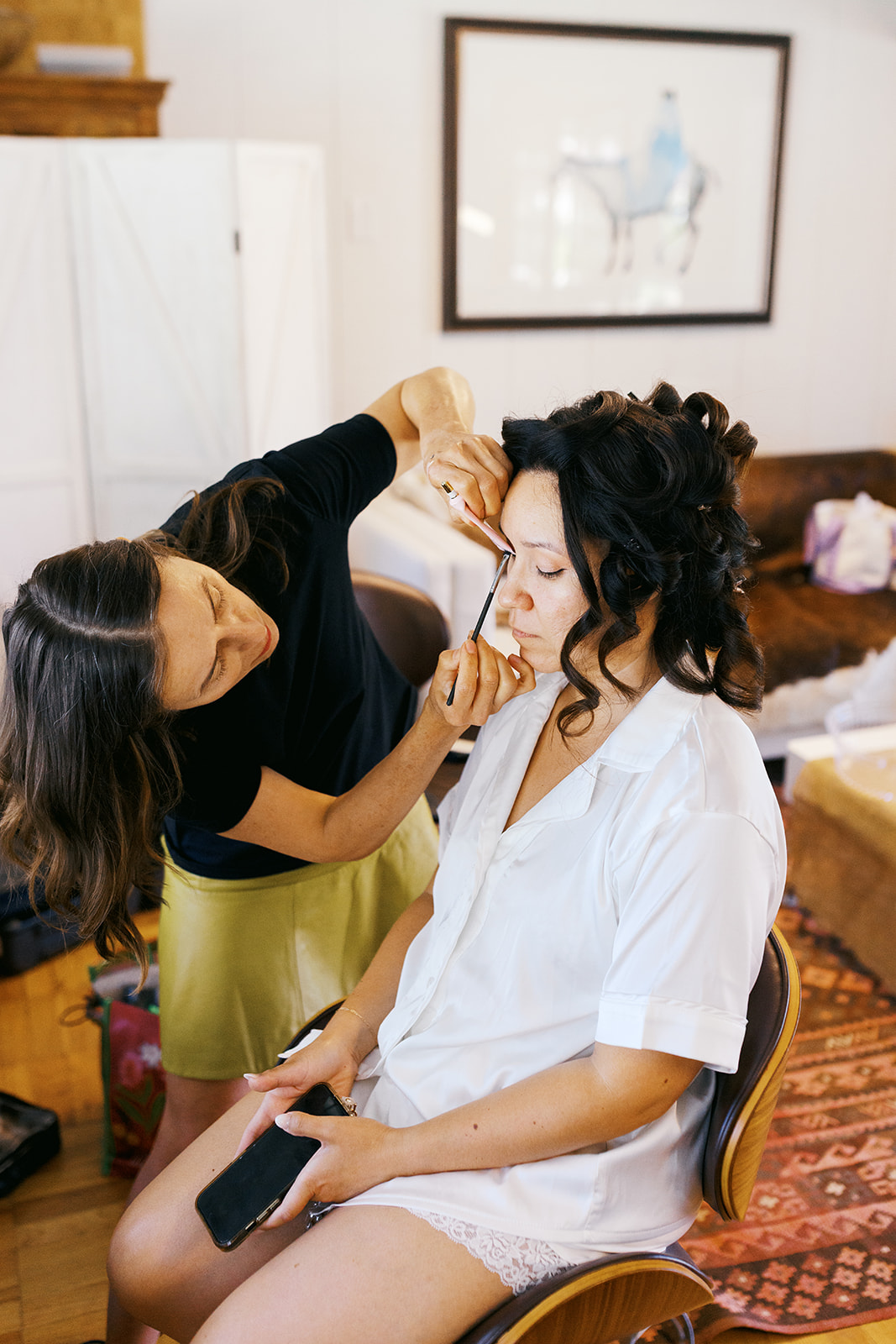 Rachel having her makeup applied before the ceremony