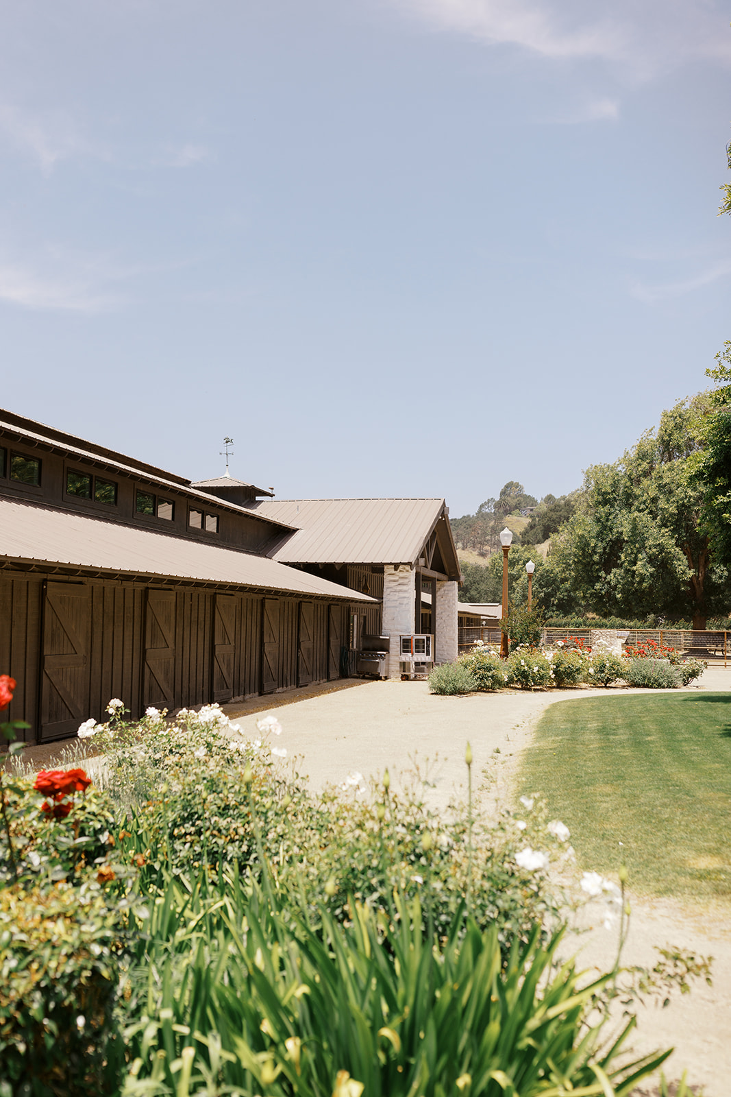Barn exterior and garden path at Whispering Rose Ranch