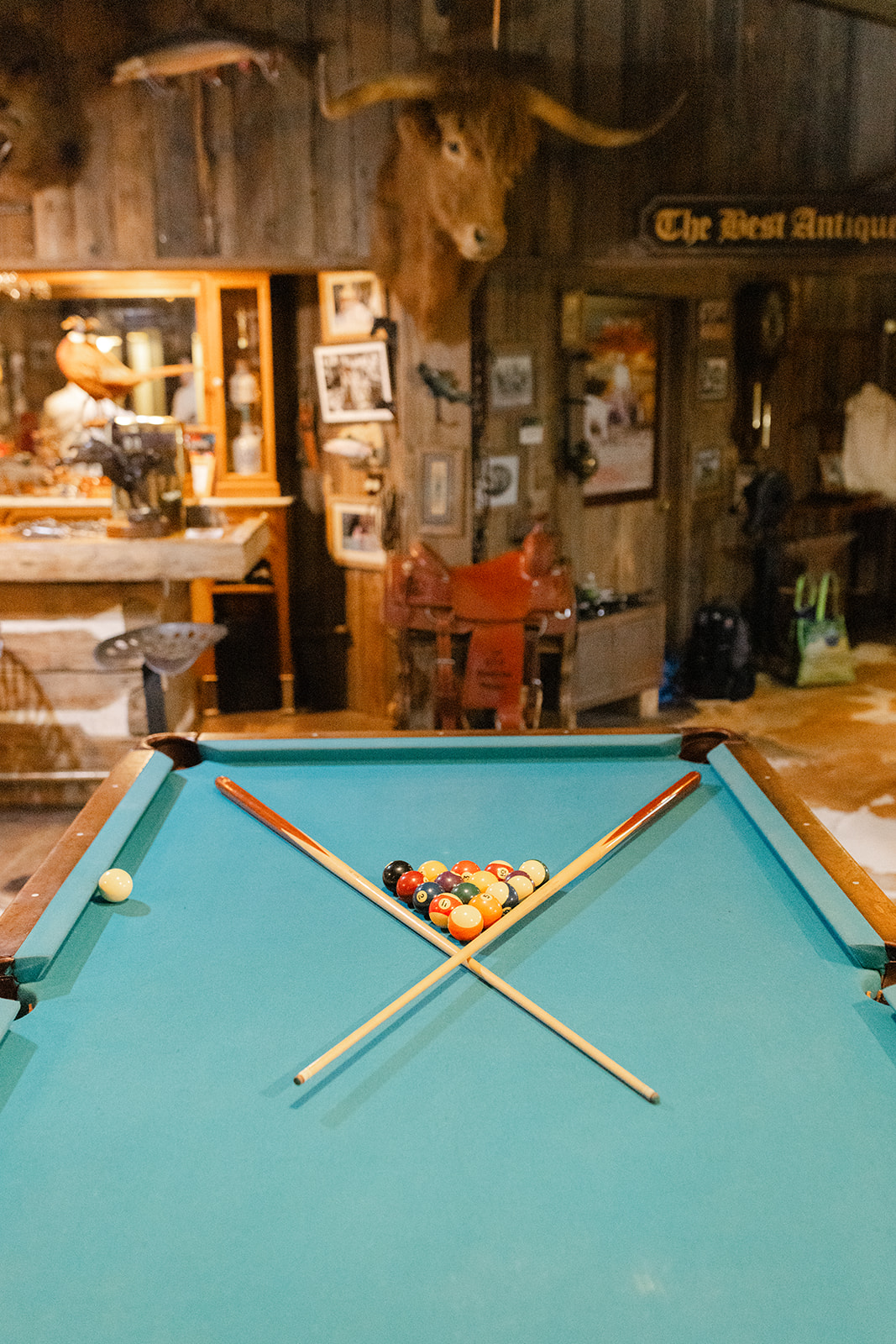 Pool table and Western decor inside the groom’s saloon