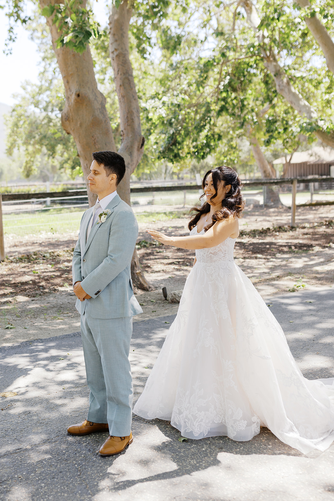 Rachel reaching toward Damien during their first look