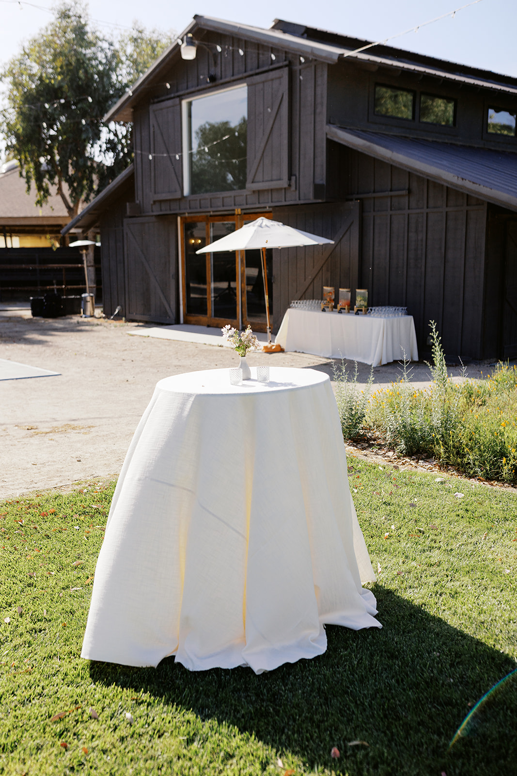 Cocktail tables outside the barn at Whispering Rose Ranch