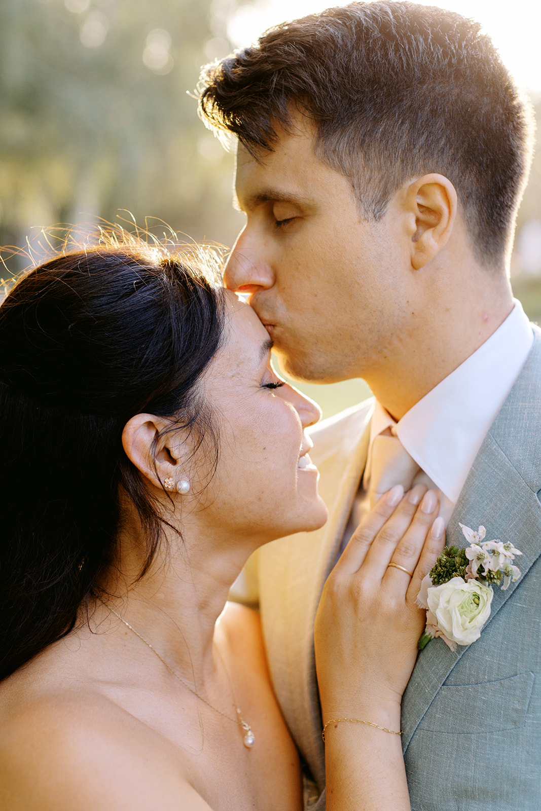 Damien kissing Rachel’s forehead in the evening light