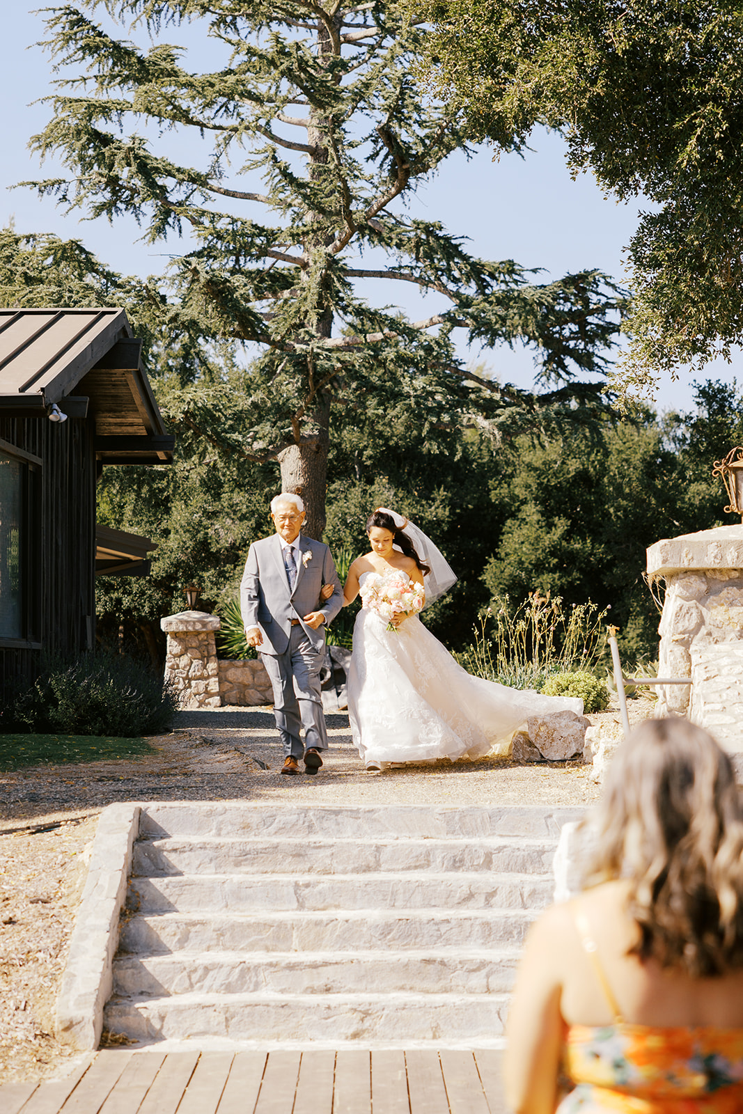 Rachel and her father approaching the ceremony space