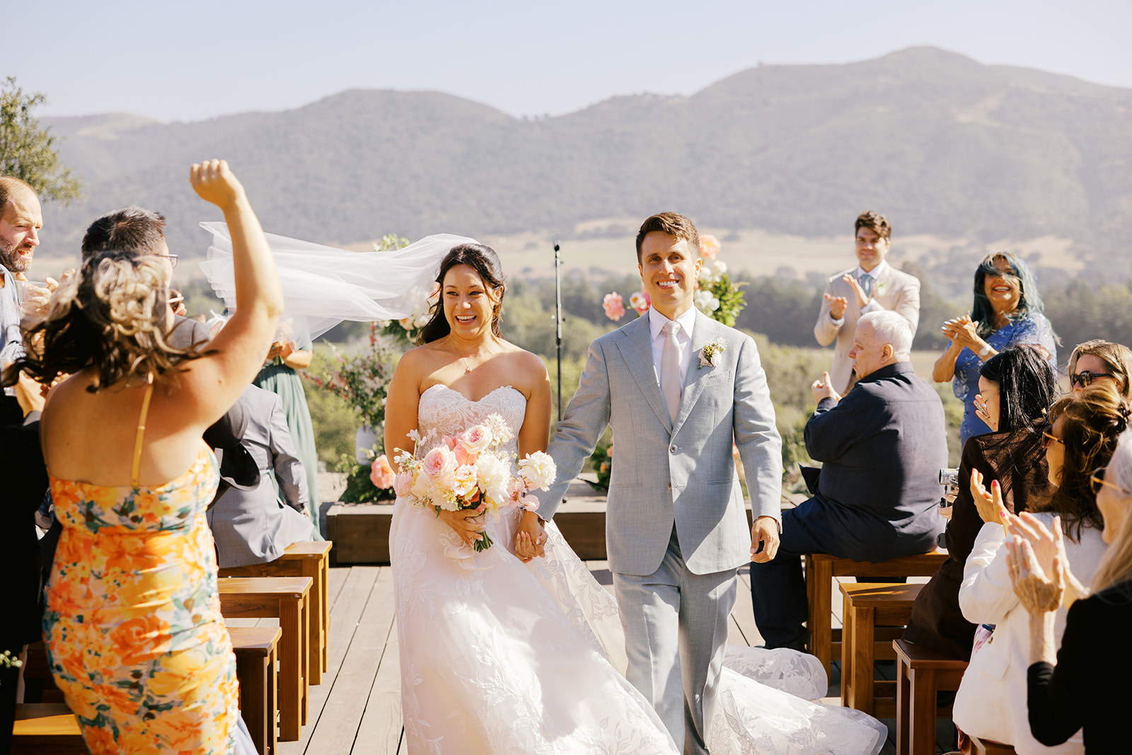 Rachel and Damien walking back down the aisle together