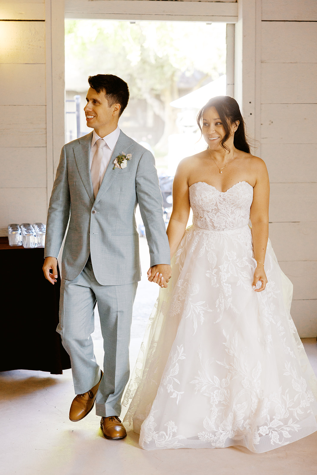 Rachel and Damien entering the barn together