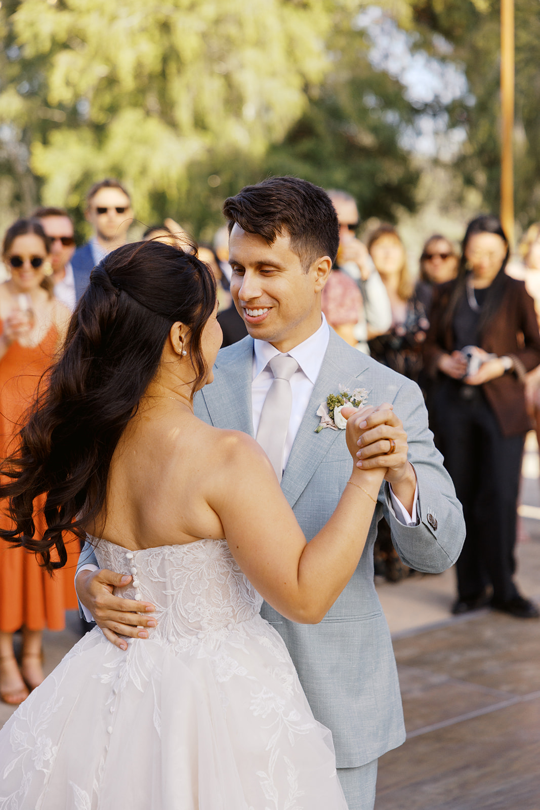 Rachel and Damien smiling during their first dance
