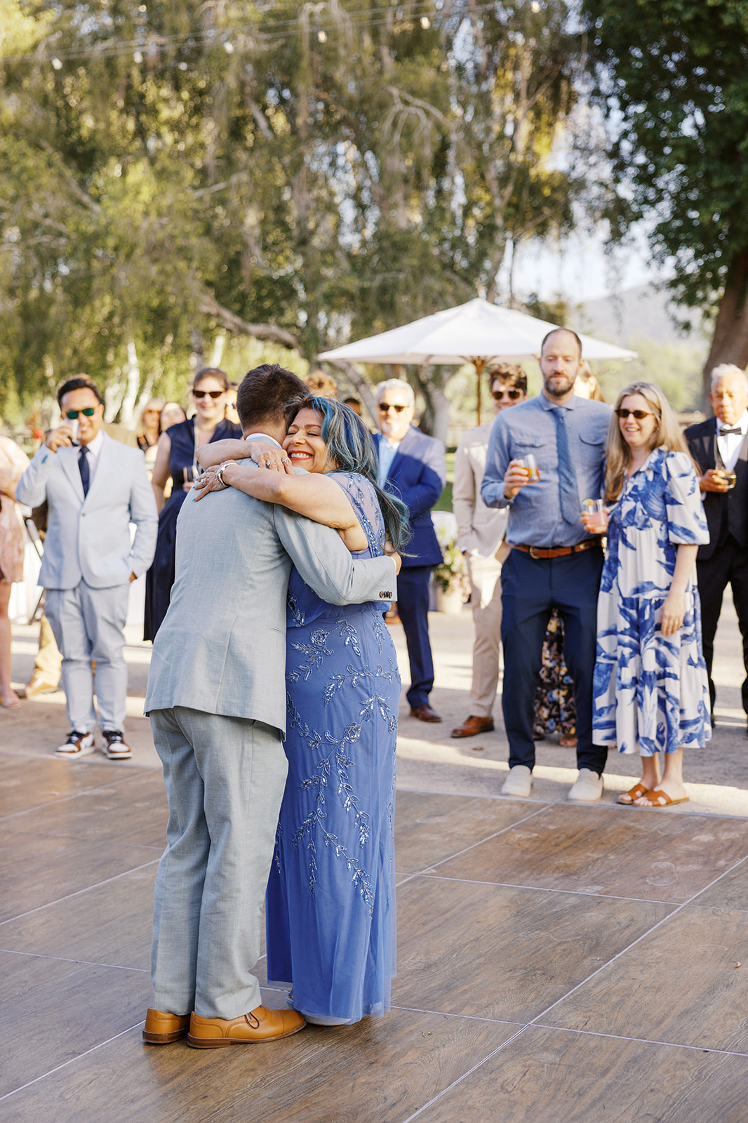 Damien embracing his mother after their dance