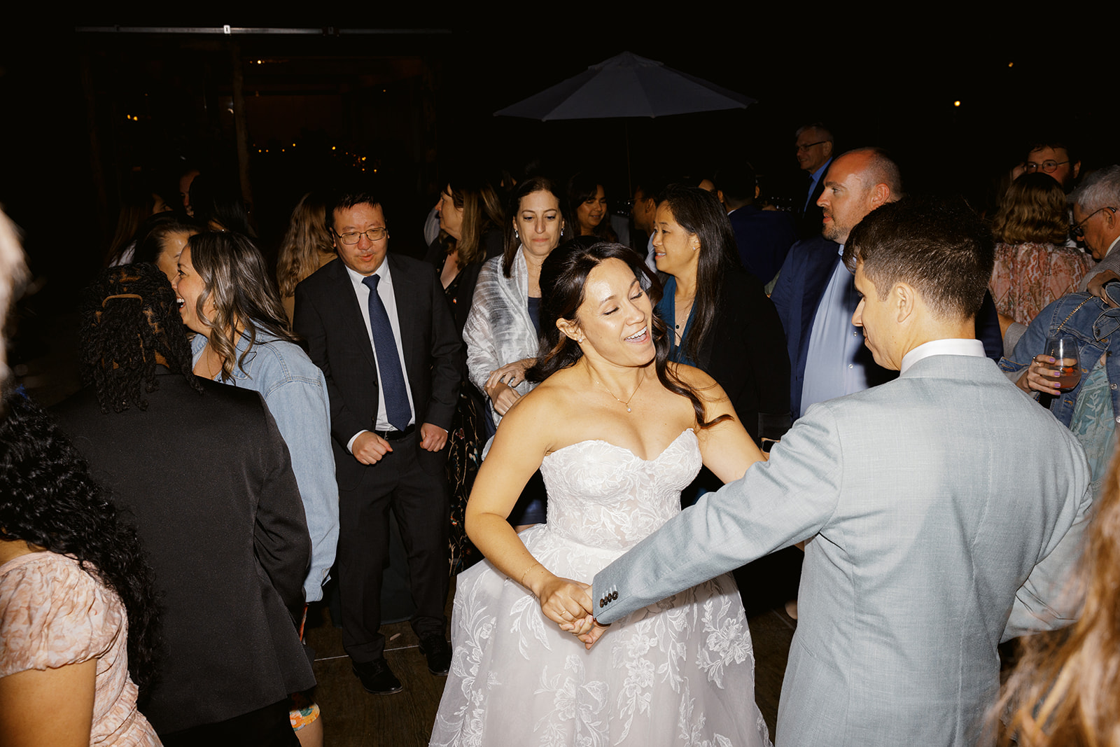 Rachel and Damien dancing among their guests
