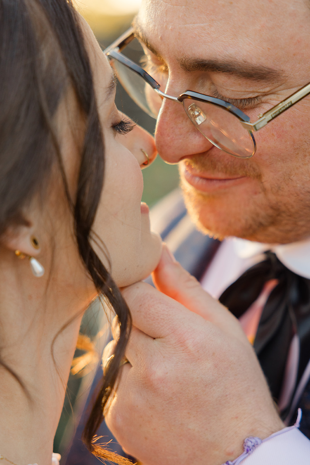 Close portrait of Jordan and Sara touching foreheads