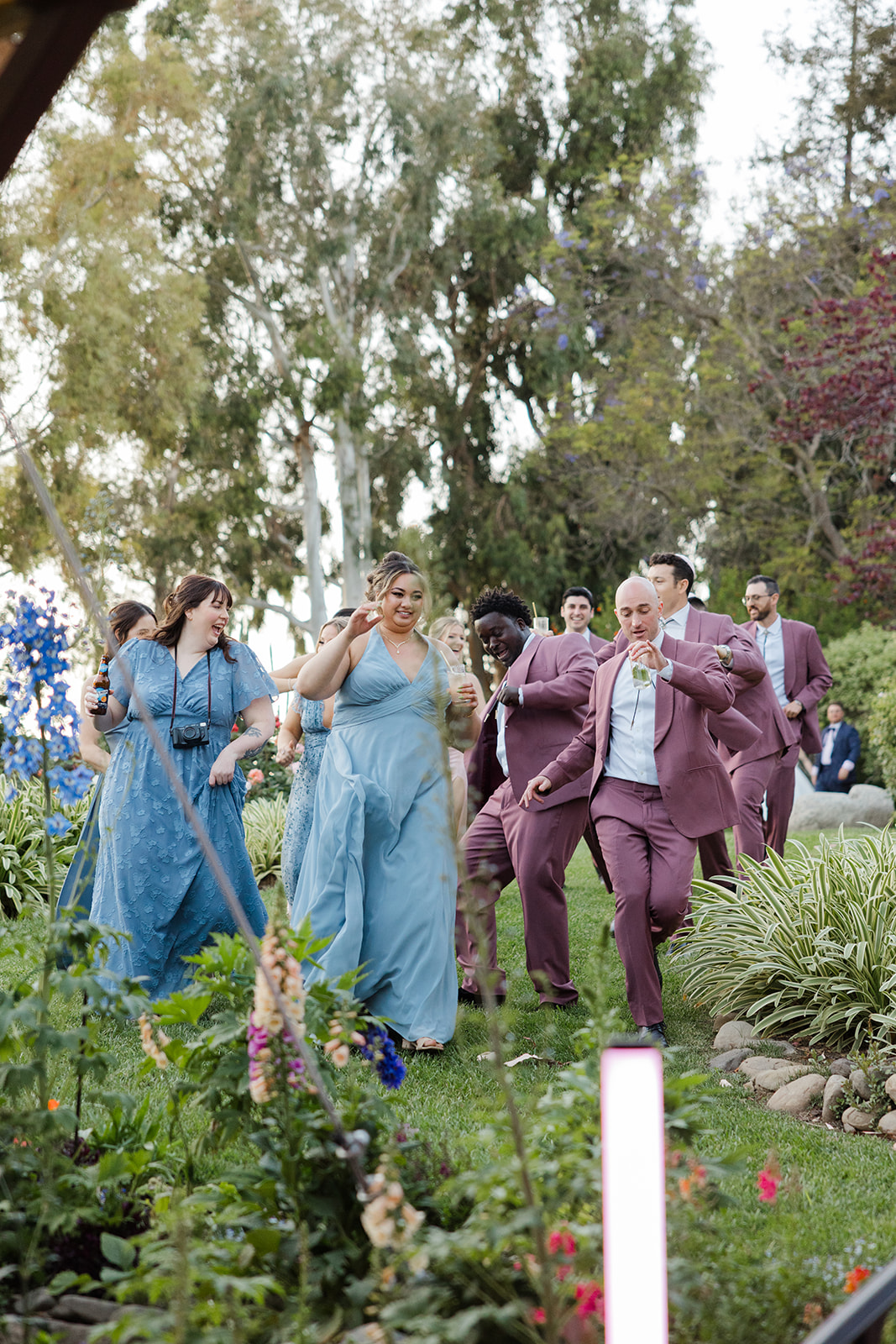 Wedding party dancing into the Maravilla Gardens reception