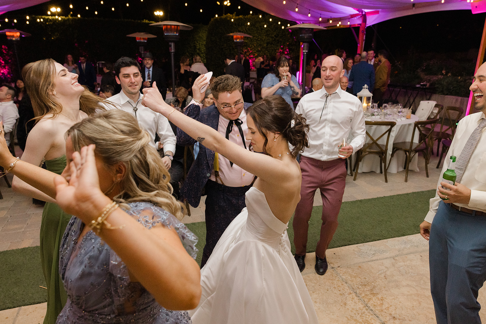 Jordan and Sara celebrating on the dance floor with their guests