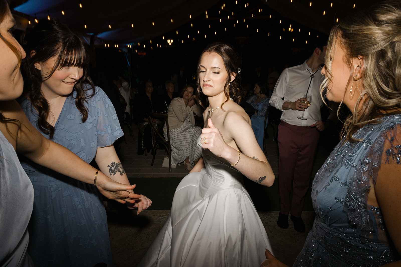 Sara dancing with friends at the wedding reception