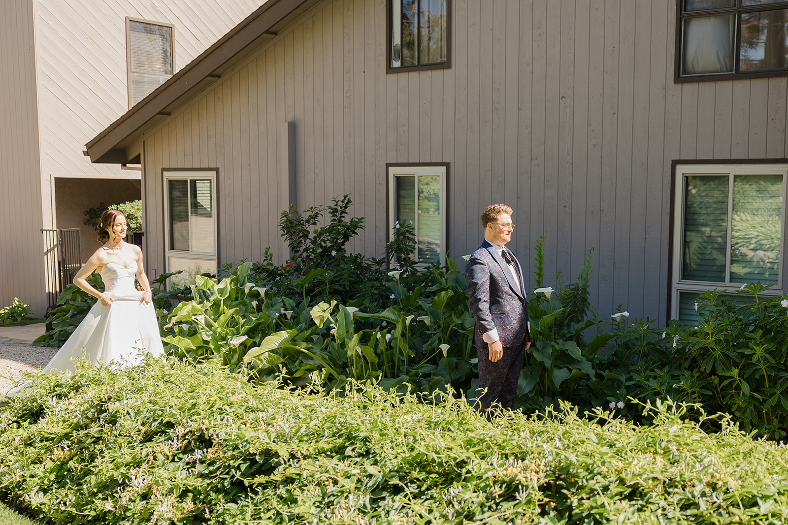 Jordan waiting beside the garden cottage before the first look
