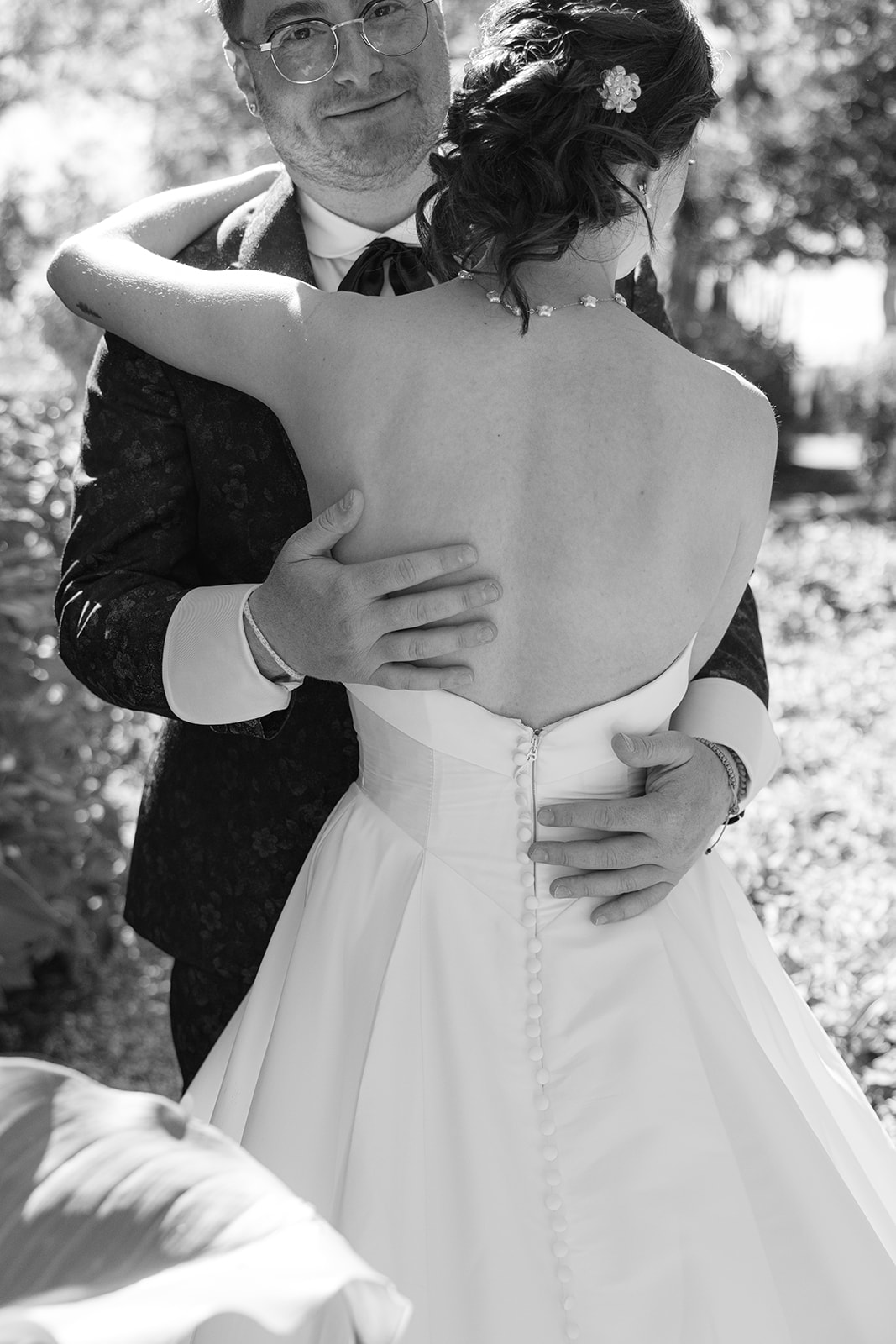 Black and white close-up of Jordan embracing Sara