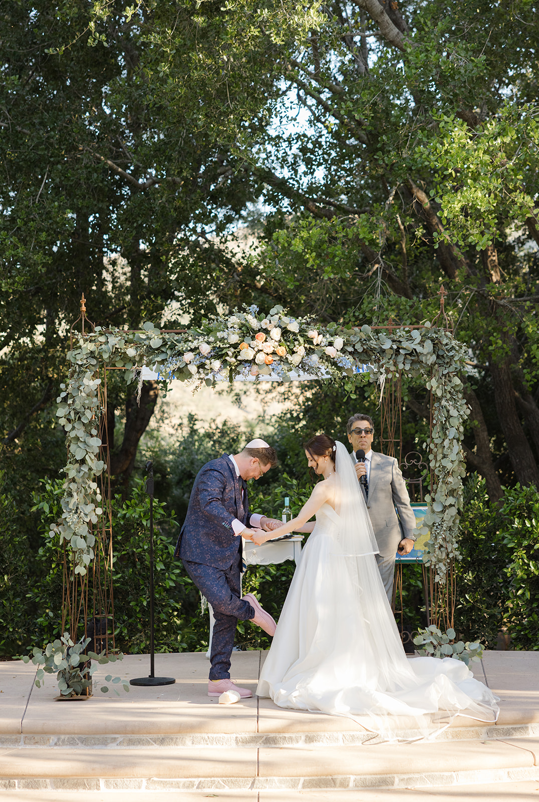 Jordan breaking the glass at the end of the wedding ceremony