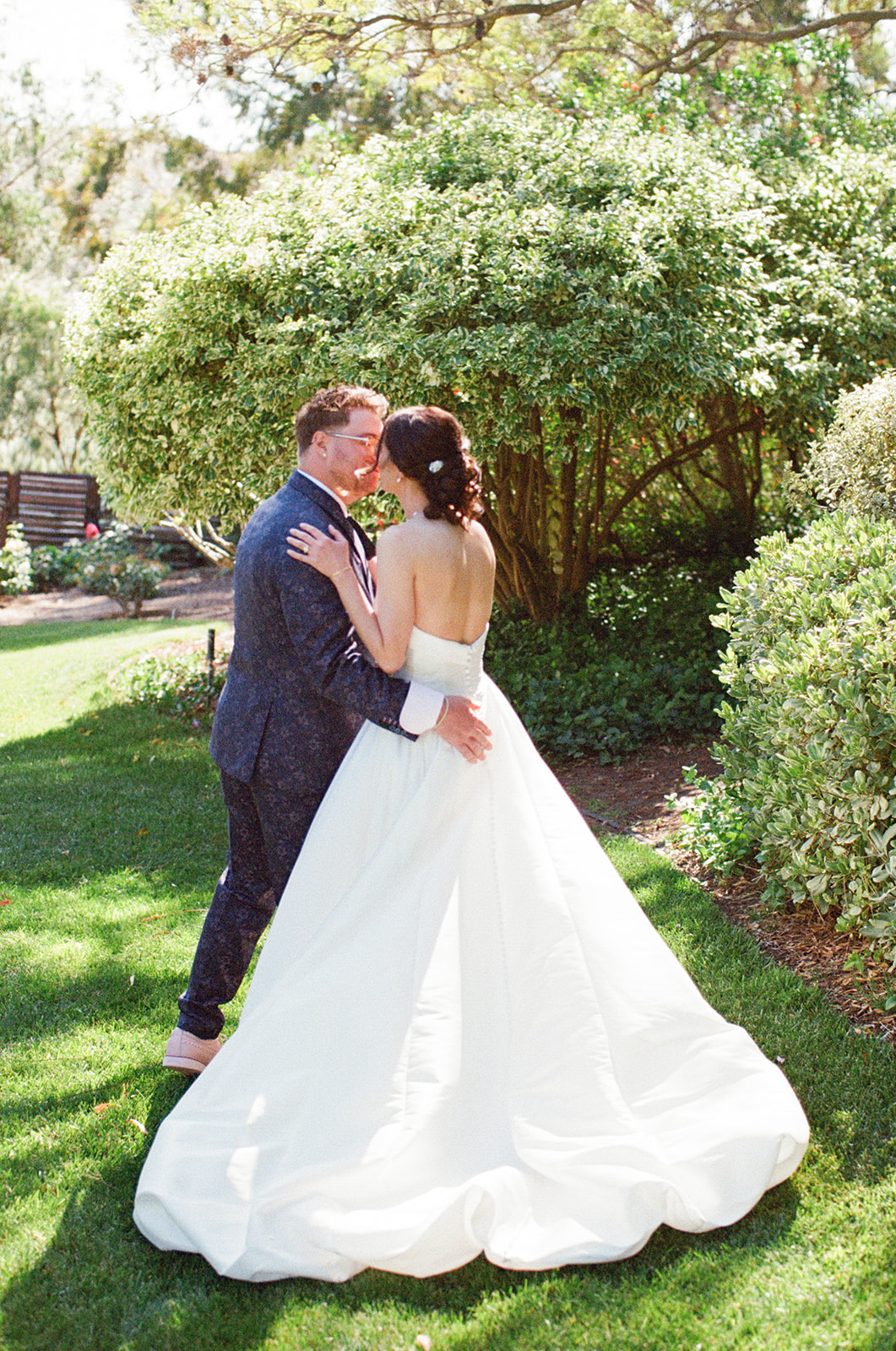 Film photograph of Jordan and Sara kissing in the garden