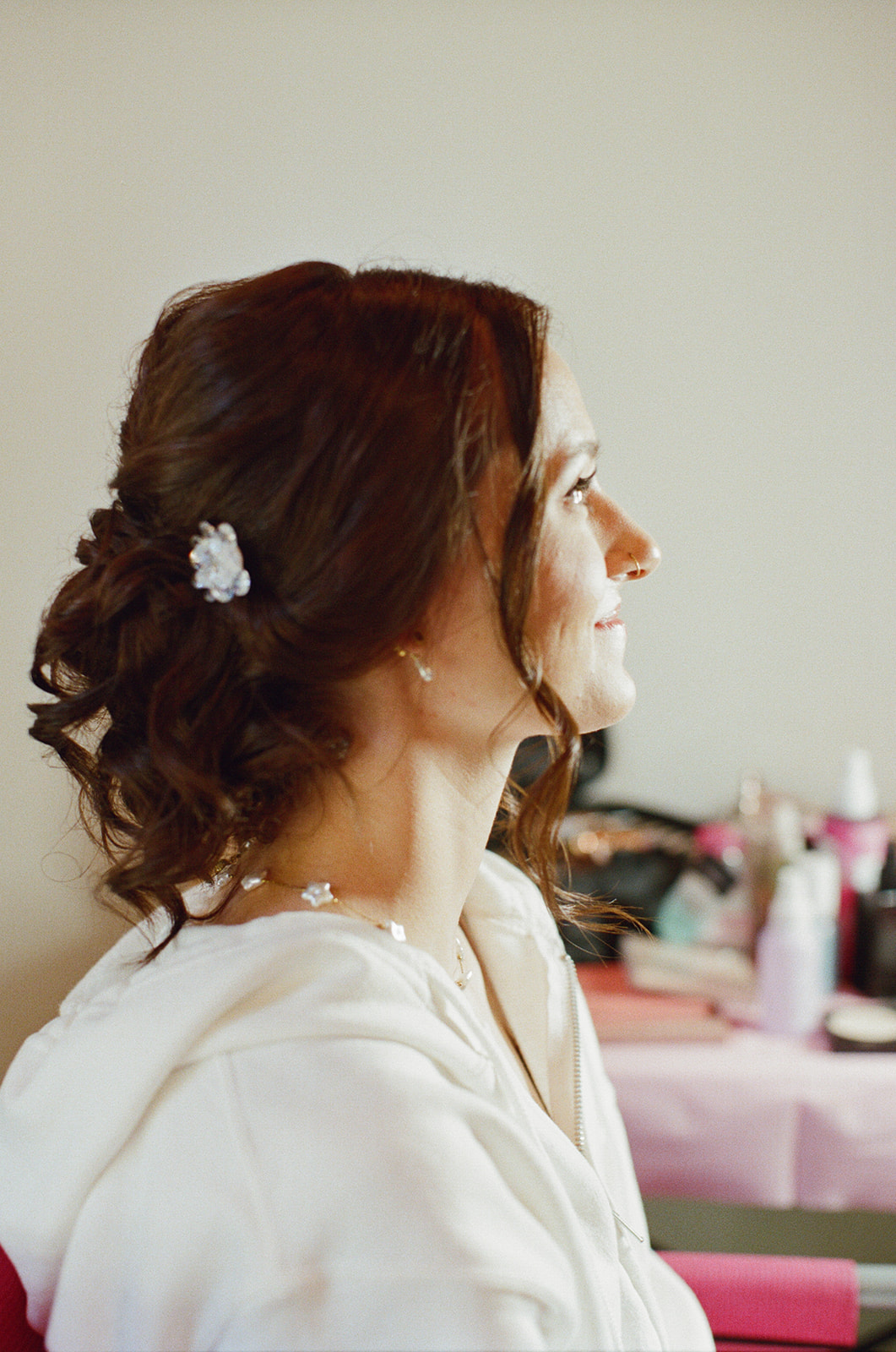 Film photograph of Sara during her makeup preparations